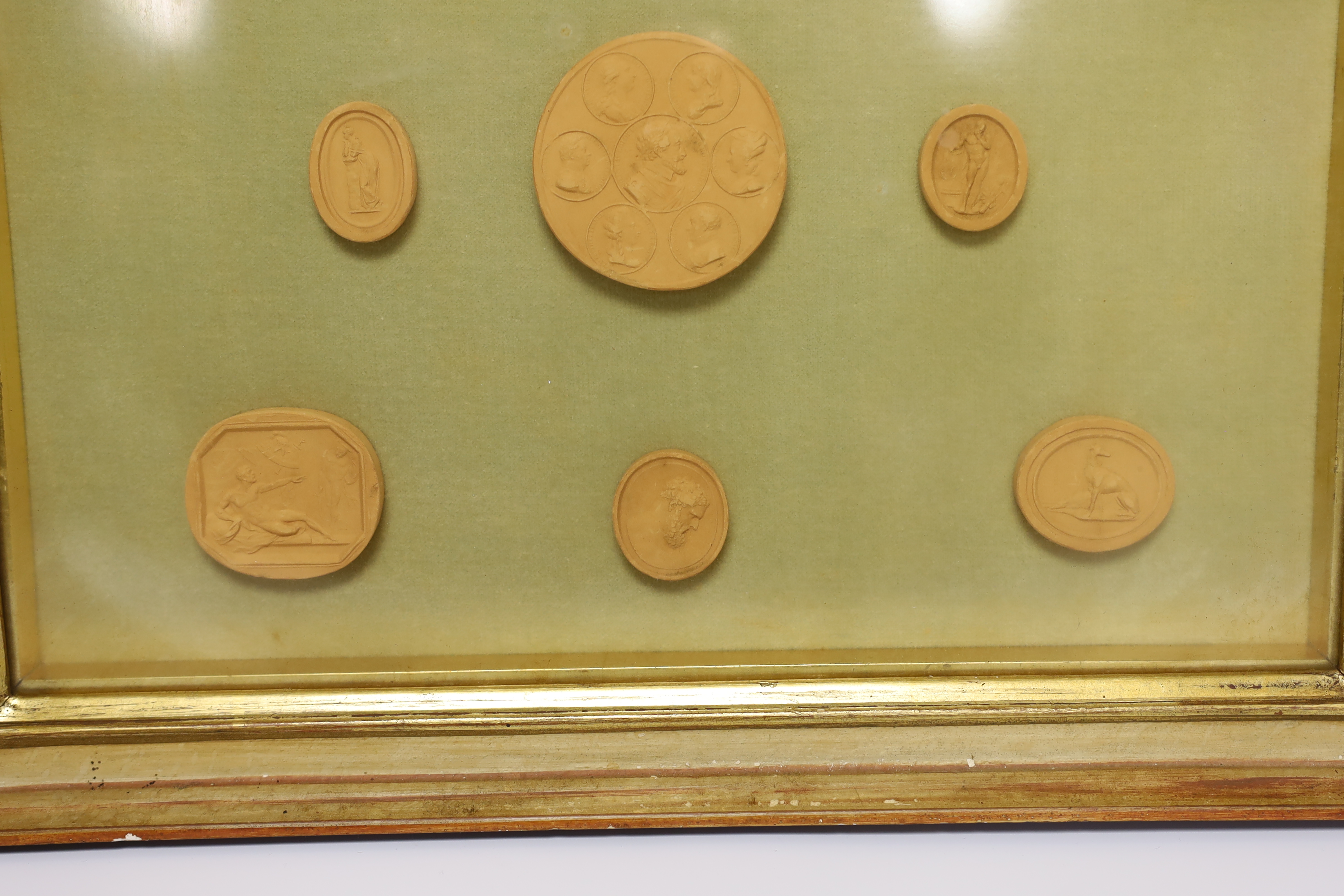 A framed set of nine grand tour medallions, 30x37cm total